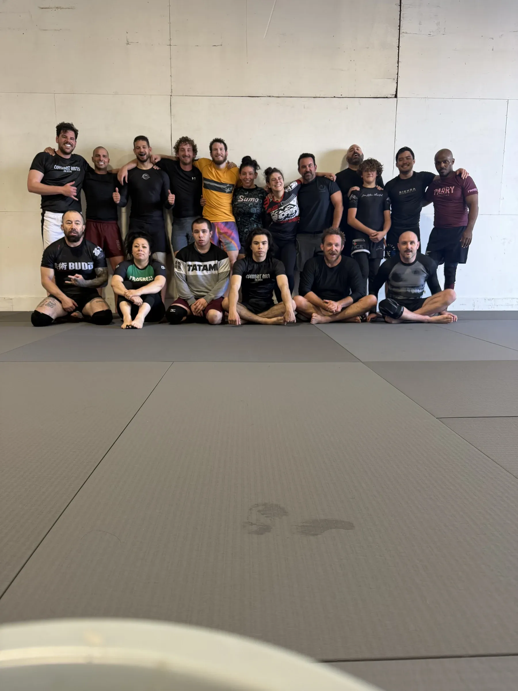 Class photo with students gathered together in the training room.